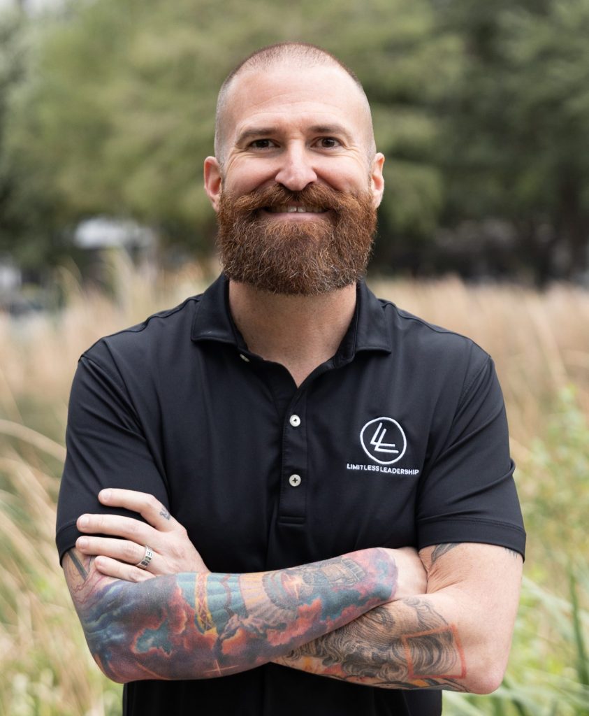 Limitless Leadership coach smiling with arms crossed